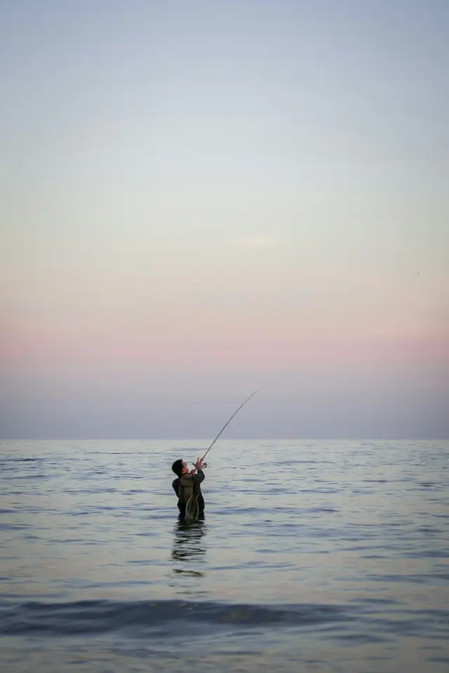 Sunrise over calm water